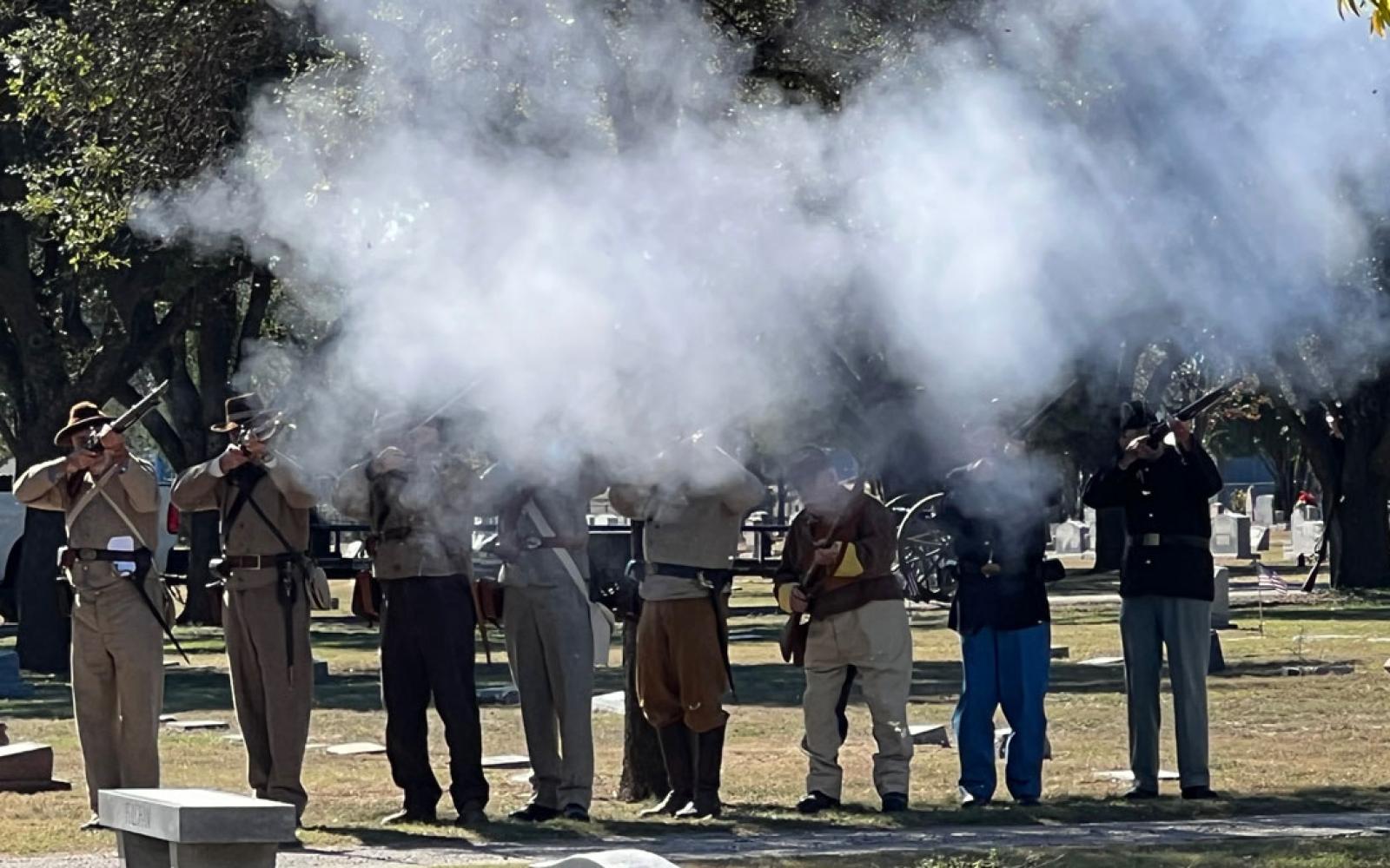 Sons of Confederate Veterans and Sons of Union Veterans perform a 21-gun salute at the Veterans Day memorial service at Fairmount Cemetery on Nov. 11, 2021