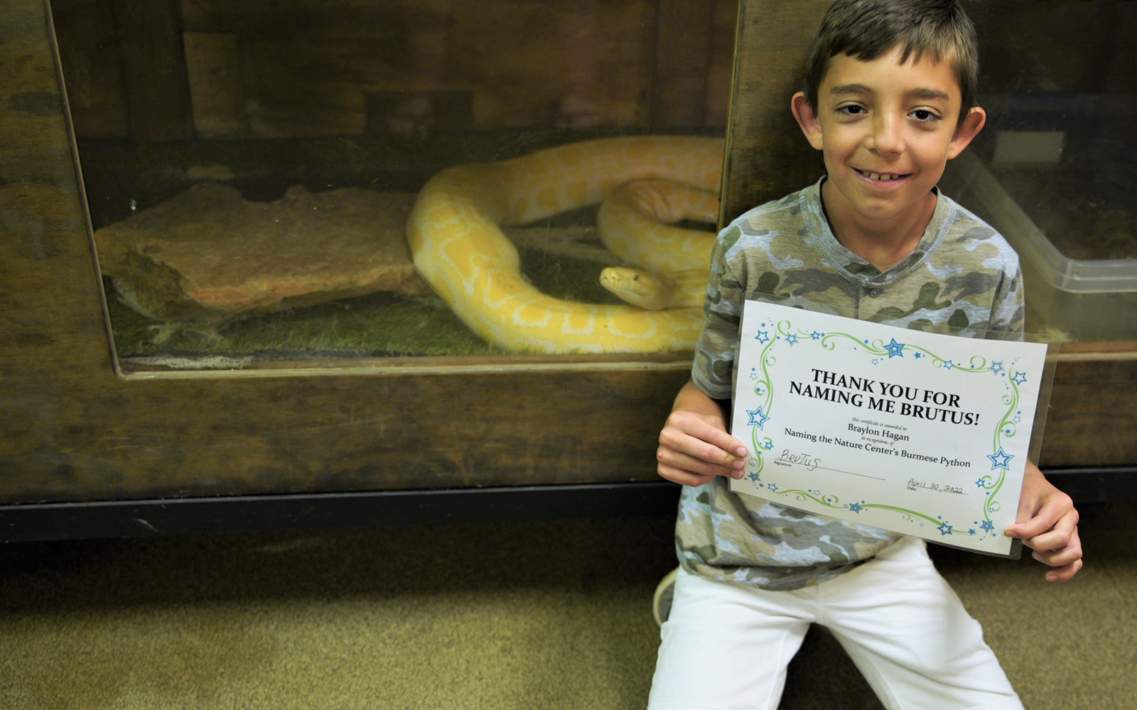 Brutus the Albino Burmese Python with Braylon