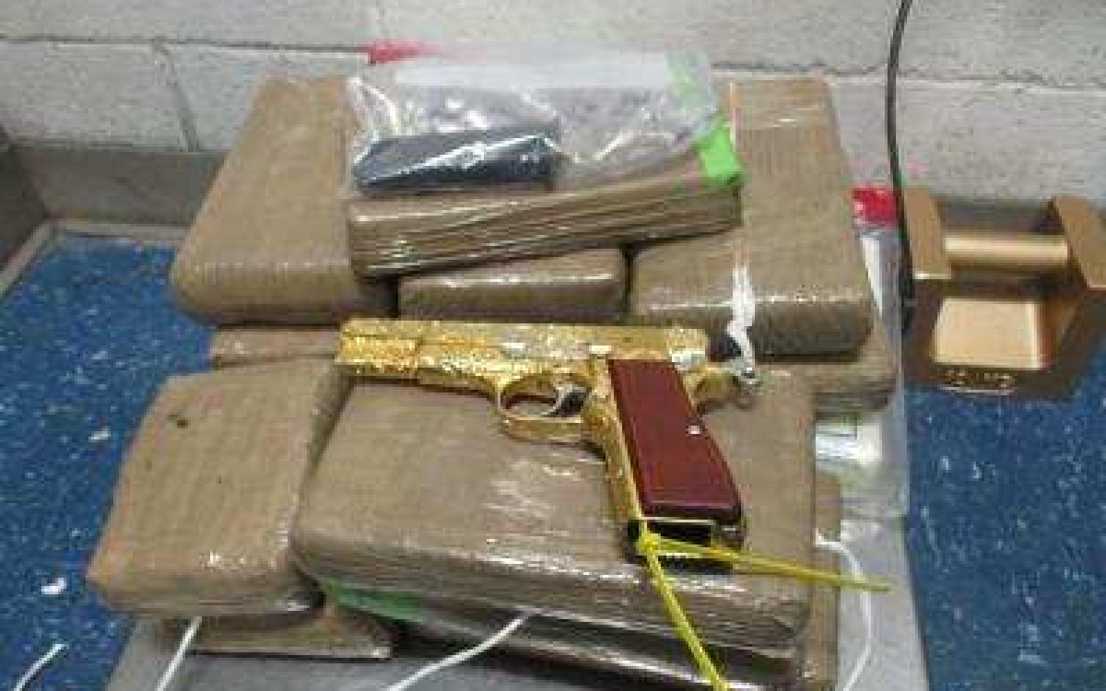34 lbs of Cocaine & a Gold Plated Pistol (Contributed/CBP)