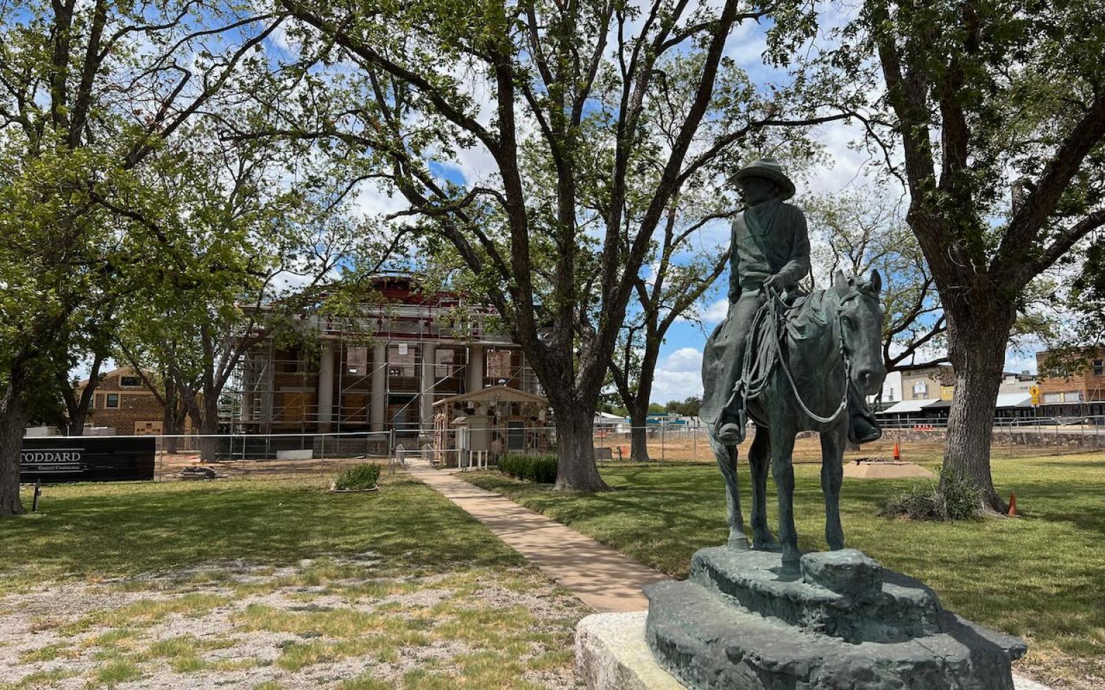 The iconic statue of a cowboy in front of the Mason County Courthouse 
