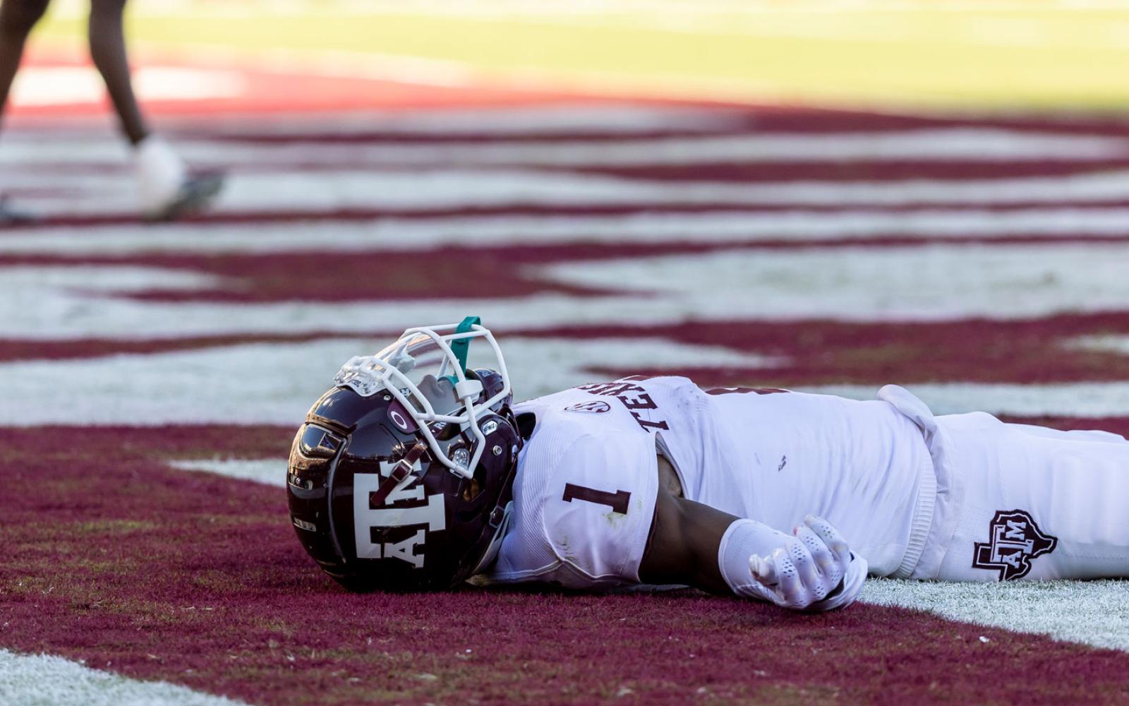 Texas A&M wide receiver Evan Stewart (1) lays in the end zone after dropping a pass during an NCAA football game against Mississippi State, Saturday, Oct. 1, 2022, in Starkville, Miss. (AP Photo/Vasha Hunt)