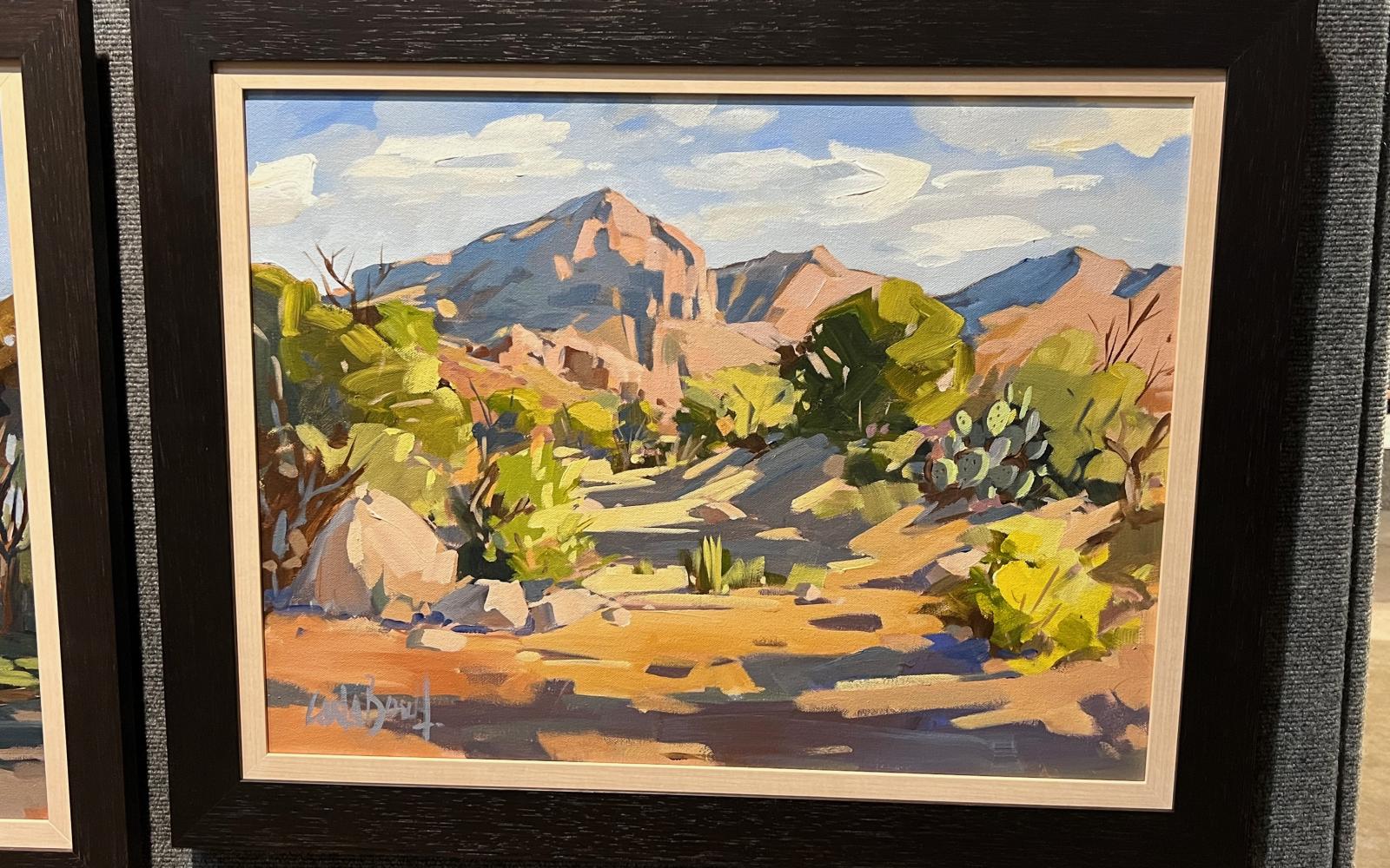 A wider view of Carla Bosch's "Rattlesnake Mountain" painting during the 2022 En Plein Air Texas competition in San Angelo, Texas