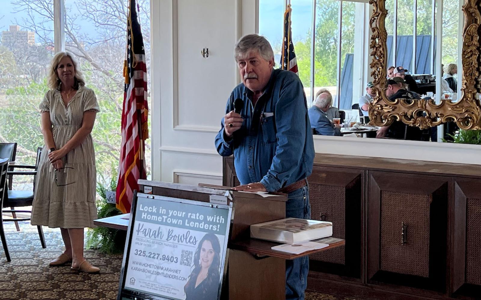 David Currie bids farewell to the Home Builders Assoc. of San Angelo. Executive director Kristen Oliver looks on. 