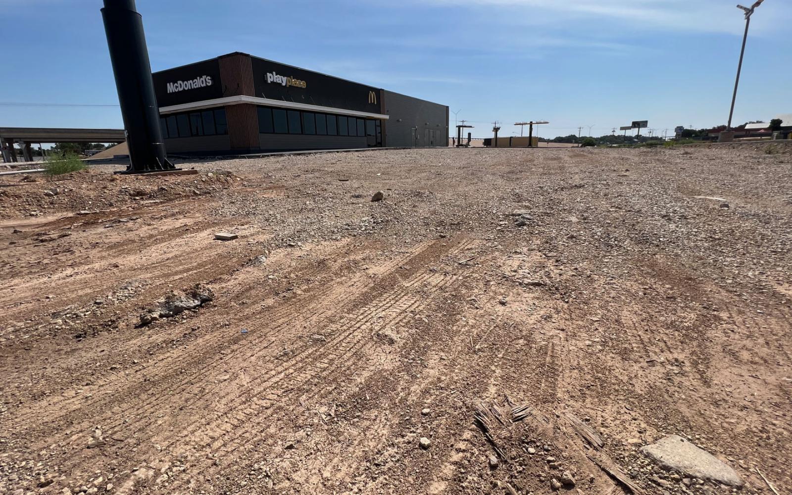 A wide shot of the unpaved parking lot at the brand new McDonalds at 4330 Southwest Blvd. in San Angelo.