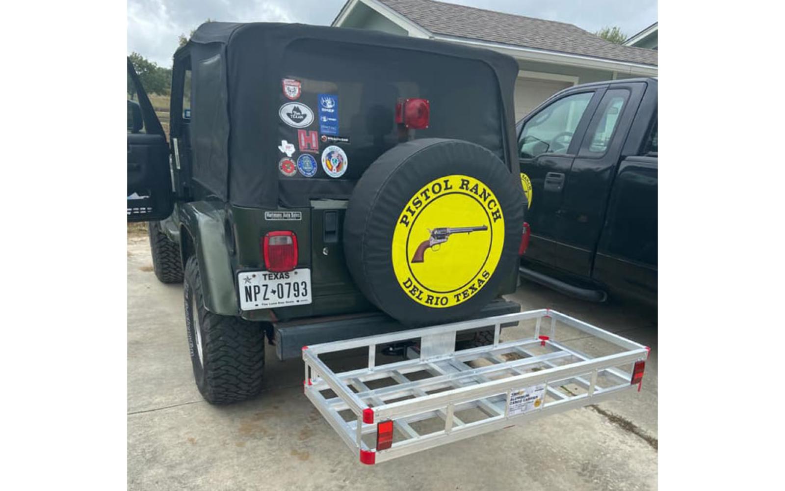 Isaack's 2006 Jeep Wrangler with a different configuration. This photo appears to be fairly recent. Note the stickers on the rear window.
