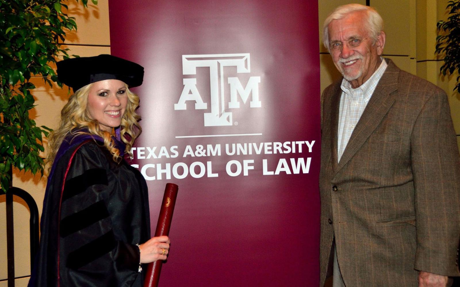 Attorney Stephanie Holan with her grandfather, Robert "Bob" Isaacks on graduation day from the Texas A&M School of Law in Fort Worth about 8 years ago.