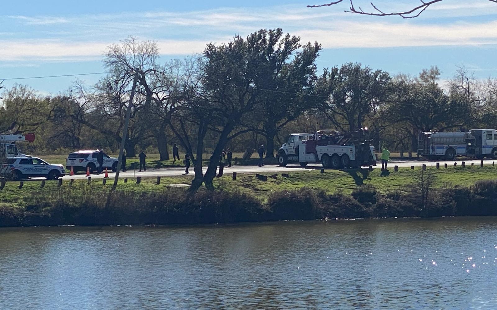 Police fish a car out of the Concho River