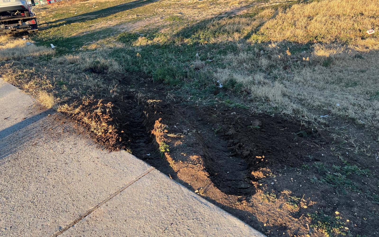 The Toyota went off-roading onto the Walmart front lawn.