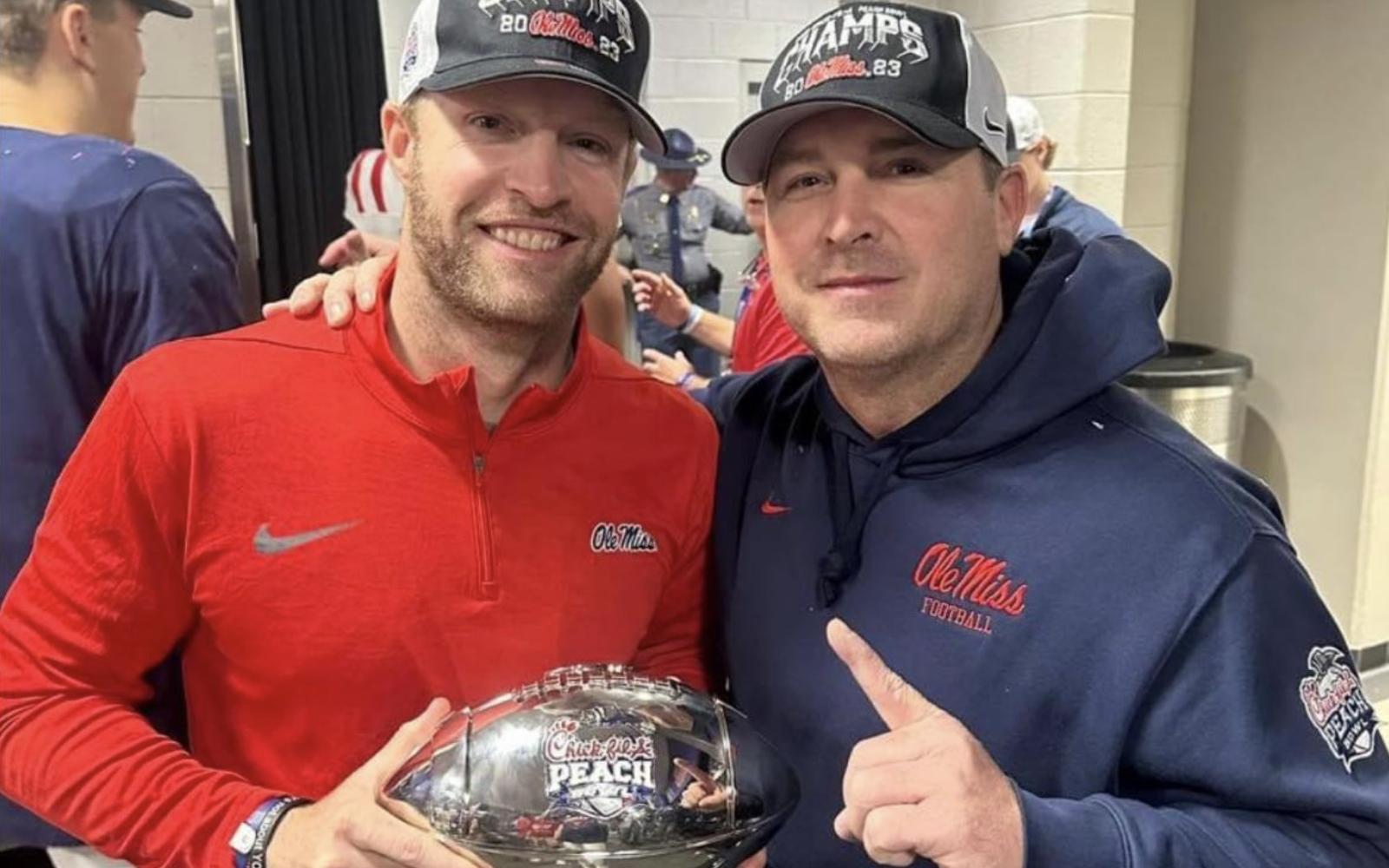 Sterlin Gilbert and John Baker Pose After Peach Bowl Win