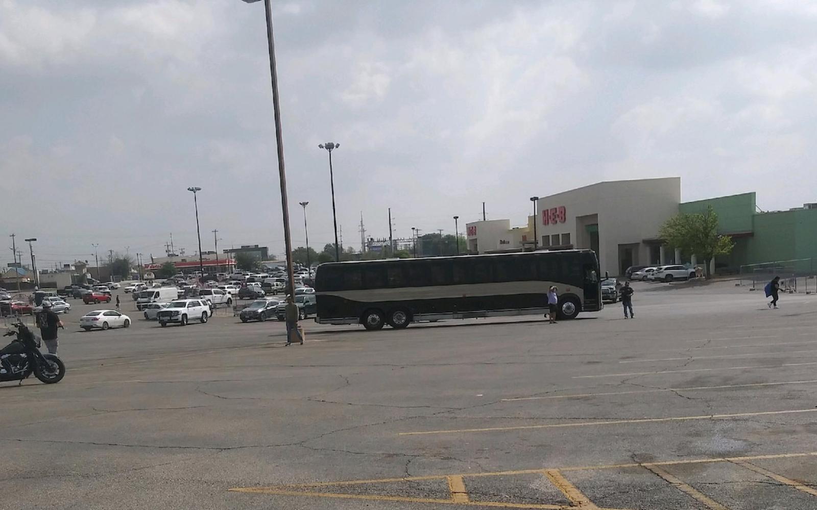 A mysterious bus full of males was unloaded at the old H-E-B parking lot on Wednesday at around 11:30 a.m.