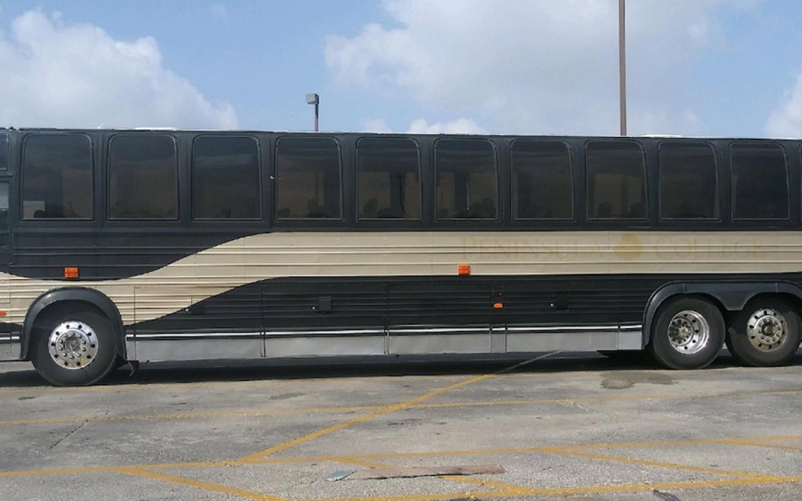 A mysterious bus full of males was unloaded at the old H-E-B parking lot on Wednesday at around 11:30 a.m.