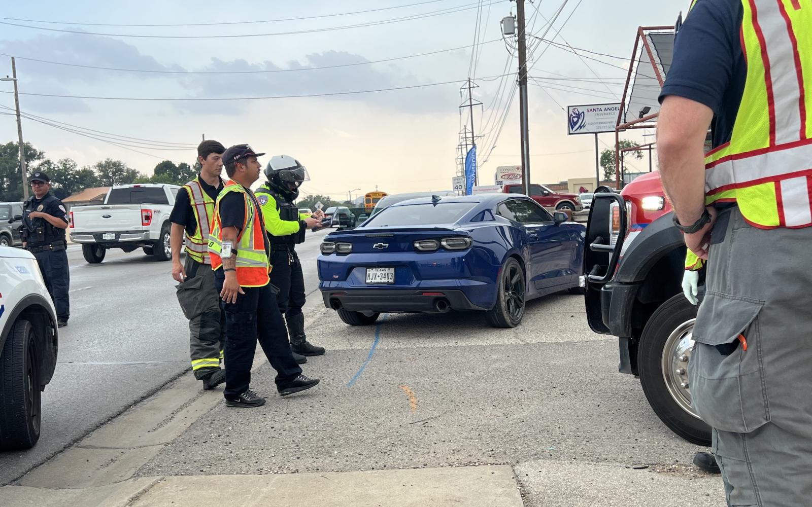 Crash between a Chevy Camaro and a Grey Sedan