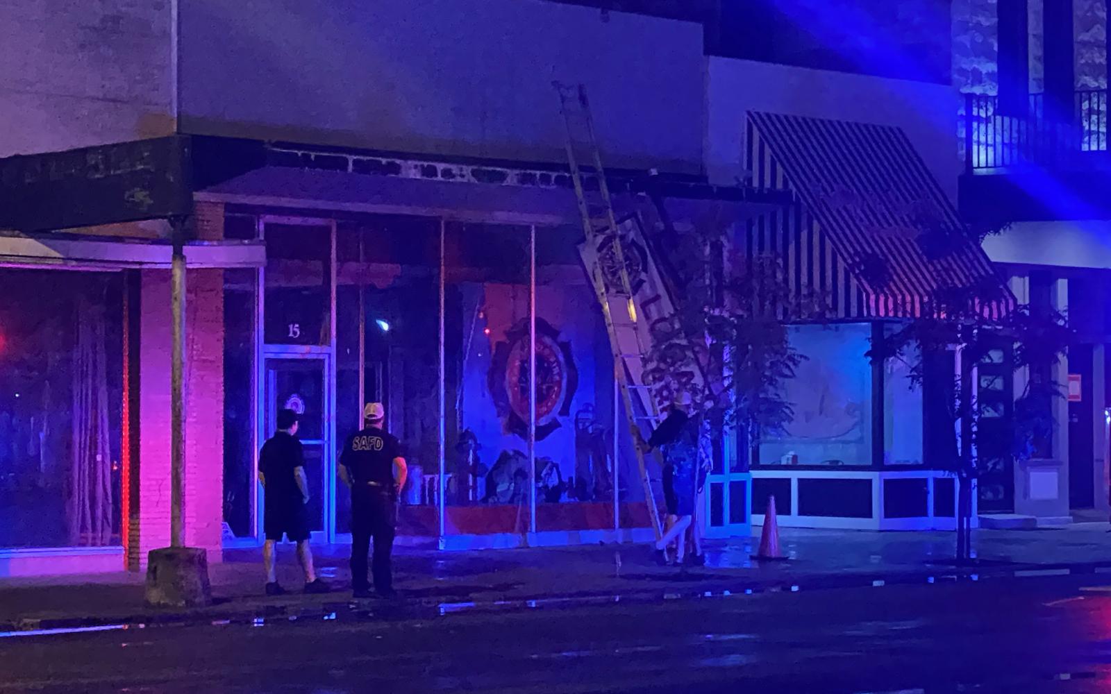 Sign on Downtown Building Falls