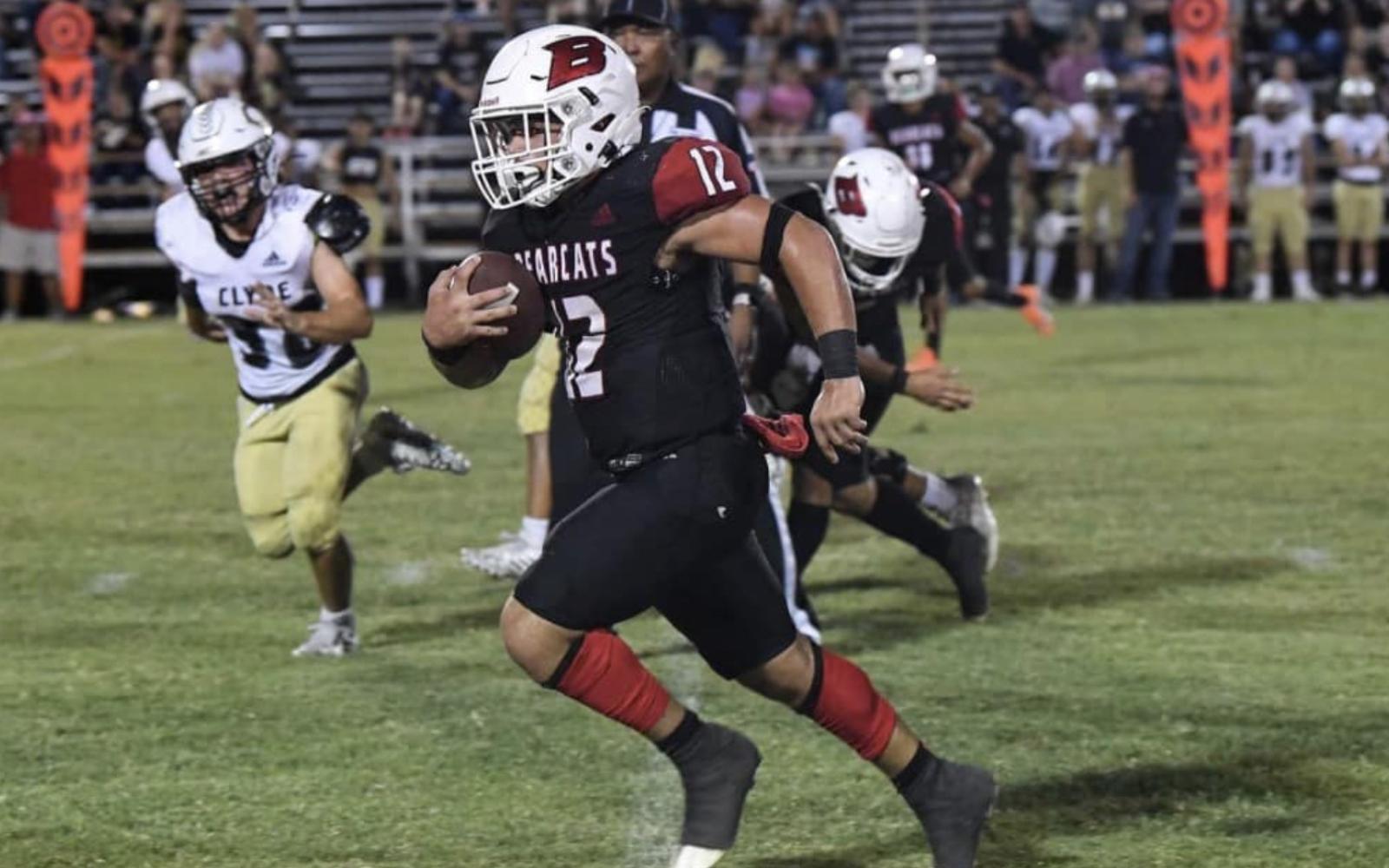 Ballinger running back Zach Canada breaks away against Clyde's defense in a 2022 game.