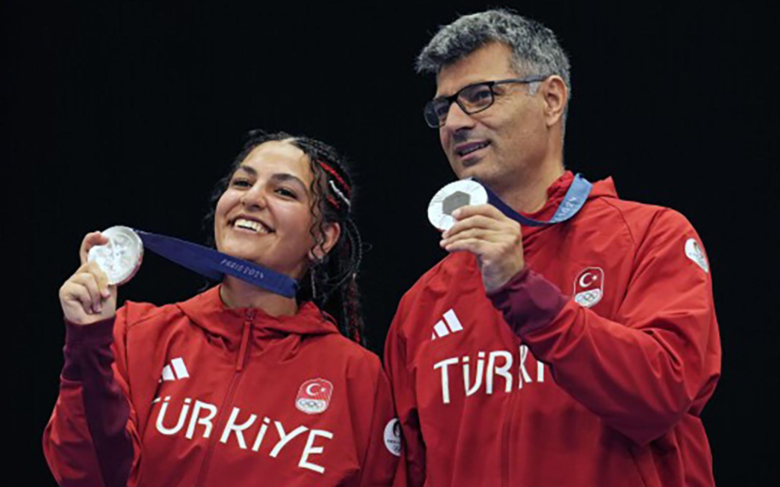 51-year-old Turkish fellow named Yusuf Dikec showed up for the pistol match in a T-shirt, with no special gear, and nonchalantly shot a near perfect score, with one hand in his pocket, to win the silver medal with his teammate. 