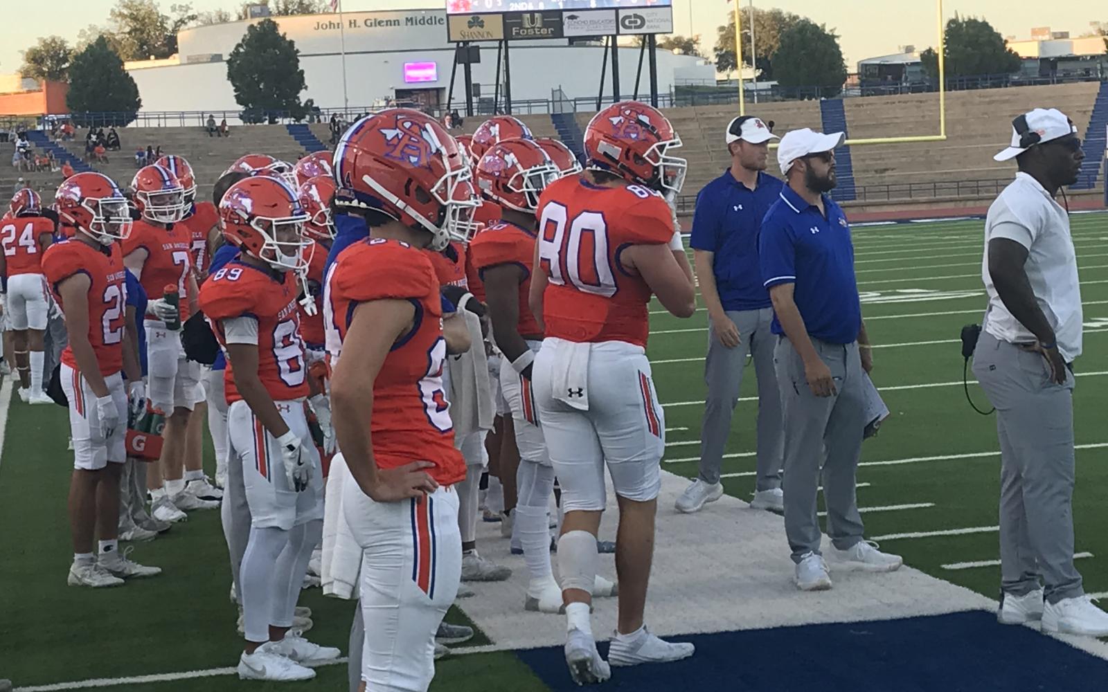 San Angelo Central football players and coaches watch from the sideline during the Bobcats' homecoming game against Waco on Friday, Sept. 27, 2024, at San Angelo Stadium.