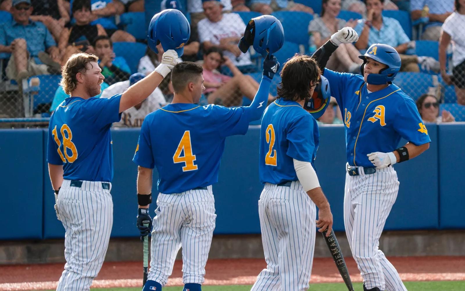 Tayten Tredaway, Austin Beck, Chase Pendley and Lane Hutchinson celebrate during the Angelo State baseball team's win over Lubbock Christian on Thursday at the NCAA Division II South Central Regional Tournament.