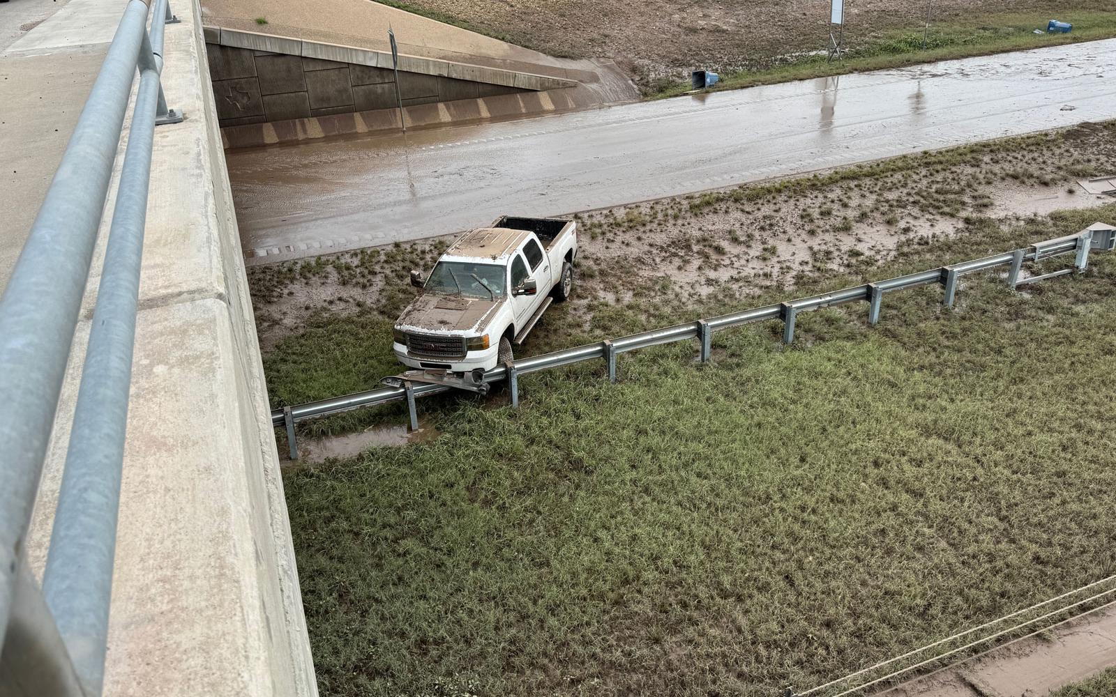 On the east side of the Bell Street overpass were more flooded cars revealed after the flood waters receded. 