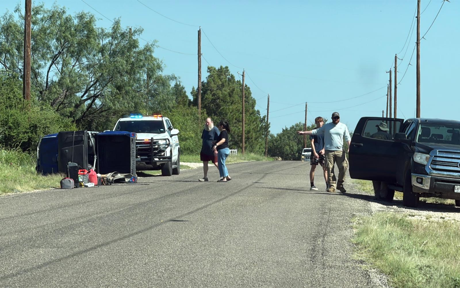 A utility vehicle is shown turned over on the side of the road after a manhunt in Dove Creek on Friday, July 25, 2025.