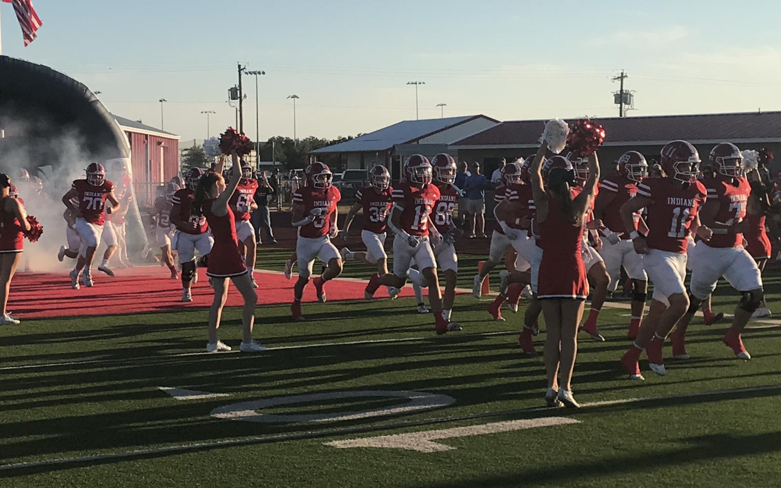 The Jim Ned Indians run onto the field before their football game with Wall in Tuscola on Friday, Sept. 12, 2025.