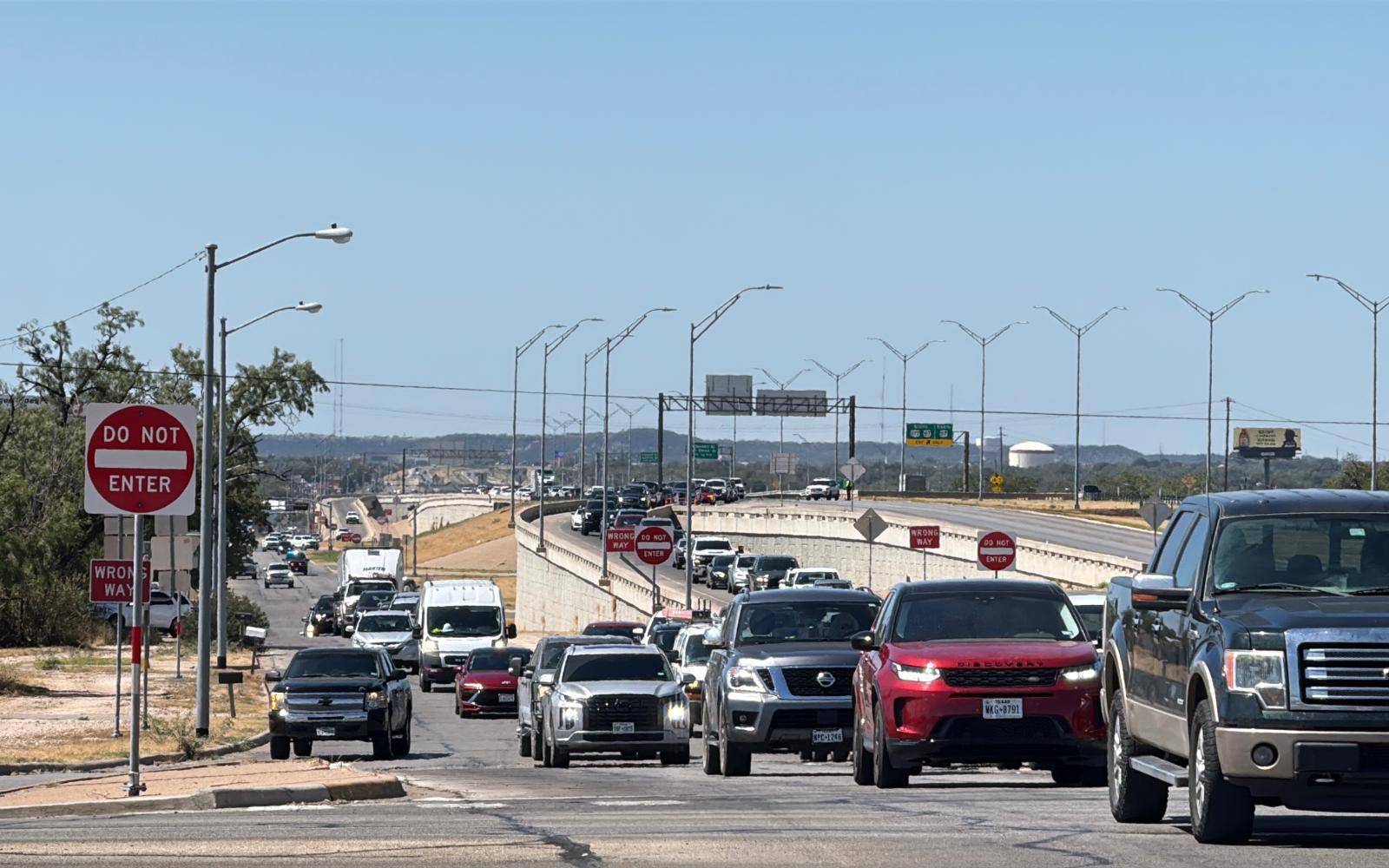 Traffic is shown backed up along the Houston Harte Expressway frontage road after a man threatened to jump from the Main Street overpass on Tuesday, Sept. 23, 2025.
