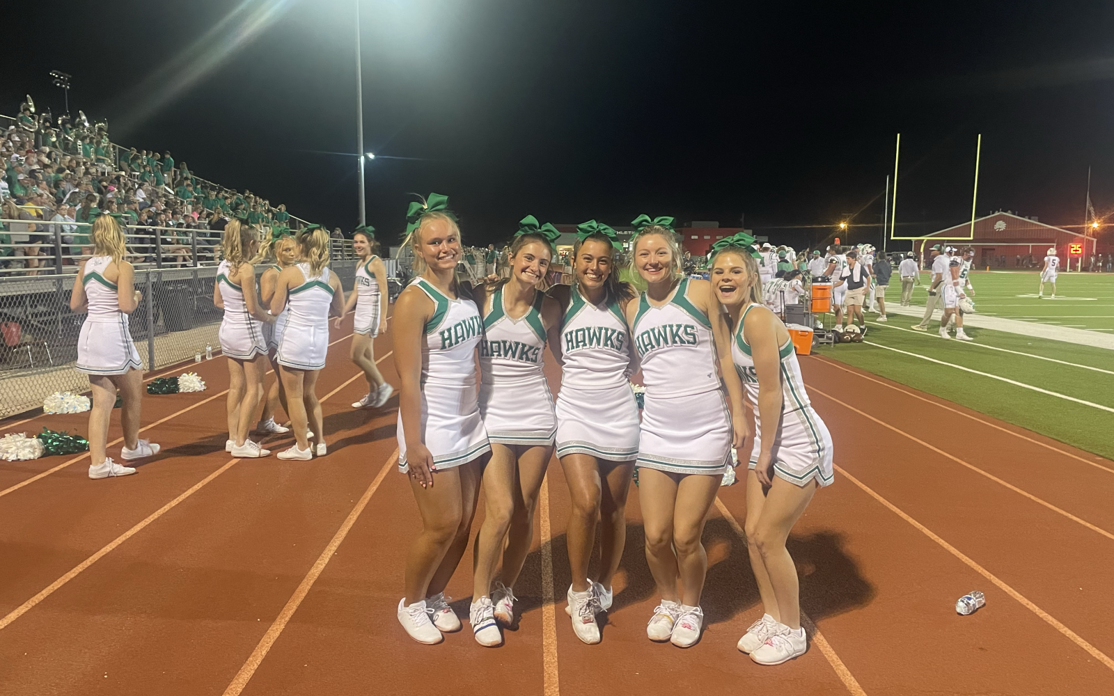 Wall High School cheerleaders are all smiles during the Hawks' 24-0 win over Jim Ned in Tuscola on Friday, Sept. 12, 2025.