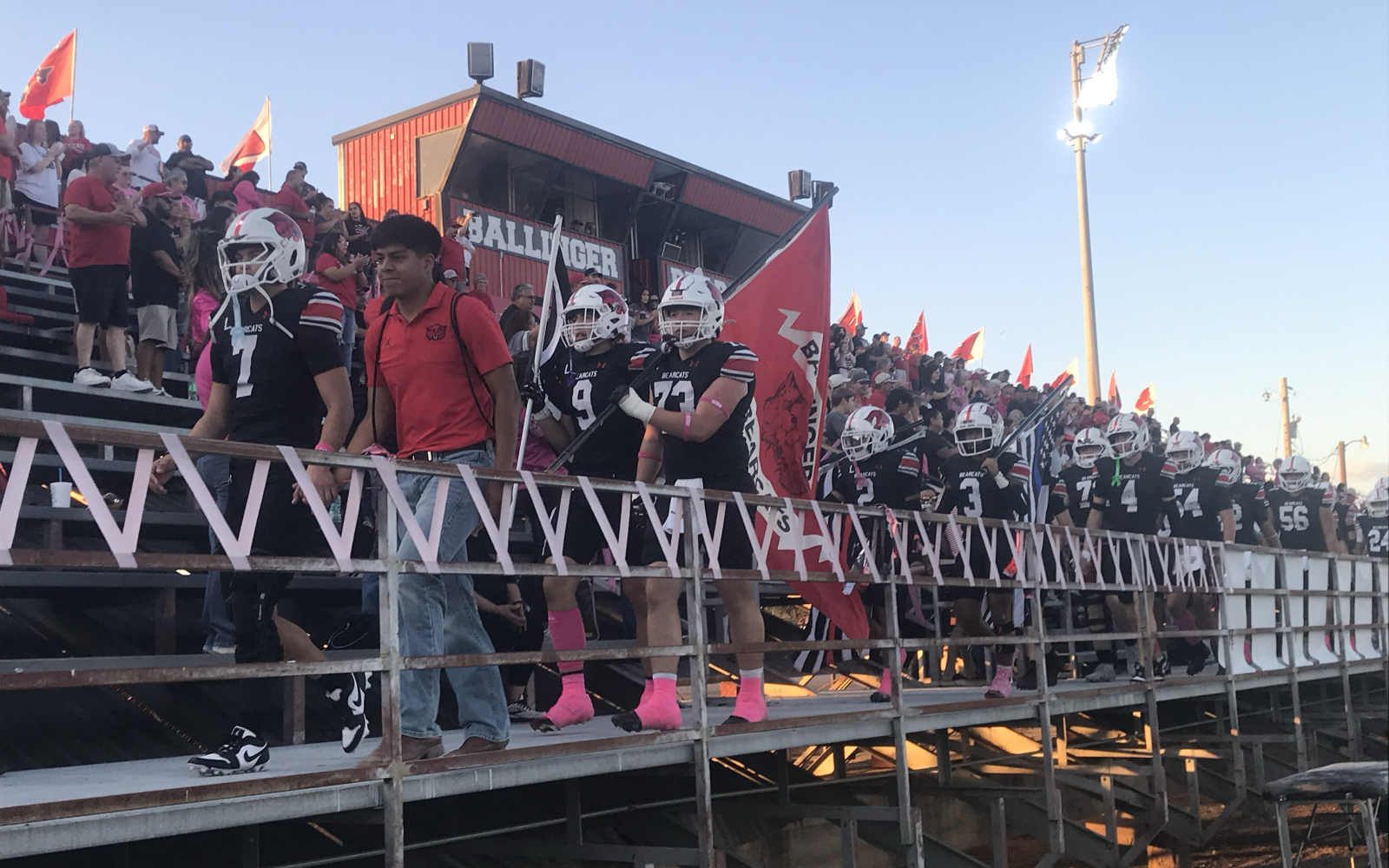 The Ballinger Bearcats walk through the home stands before their game against the Bangs Dragons on Friday, Oct. 10, 2025.