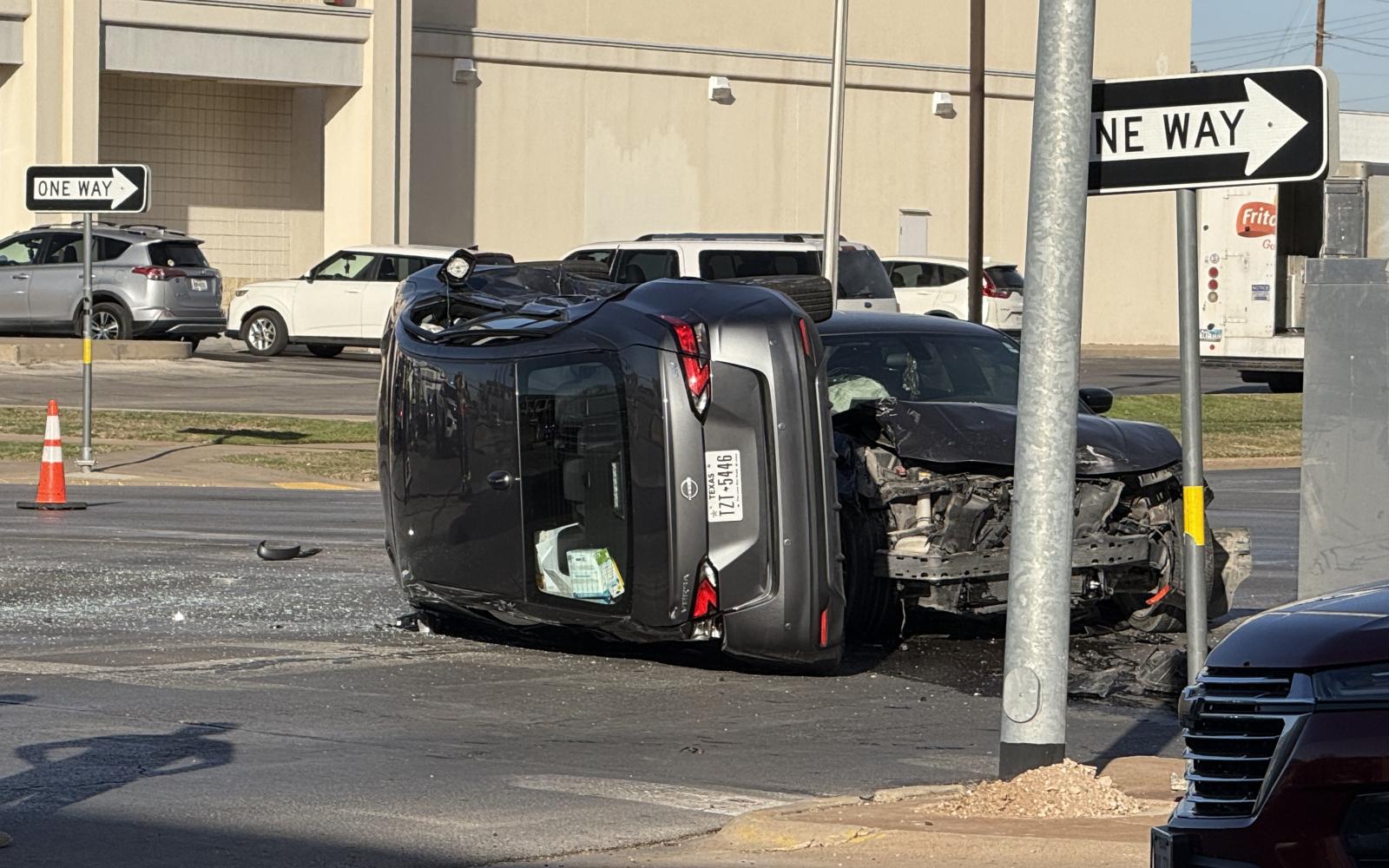 A two-vehicle collision Thursday afternoon in San Angelo resulted in one of the cars rolling over on its side, completely shutting down Beauregard Avenue between Abe and David streets.