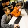 Arthur Grenner, 13, left, Chad Darden, 12, and Steve Yanes, 13, at right, engage with the video game platform Roblox during the Thousand Oaks Teen Center's reopening celebration in Thousand Oaks, California on March 10, 2023.
